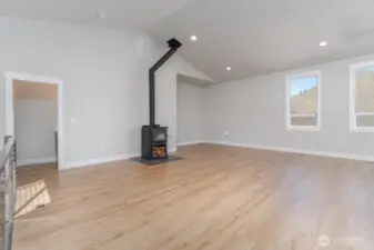 Wood stove and vinyl plank flooring.