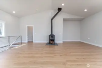 Stairs to lower lower are to the left, 1/2 bath is to the left and primary bedroom & bath are to the right.