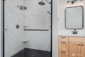 Large double-headed walk-in shower.