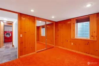 Downstairs Bedroom 5 with new egress window, and custom orange shag rug.