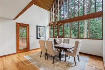 Formal Dining Room with towering windows that bring the outside in.