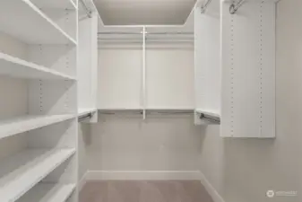 Primary walk-in closet with organizers