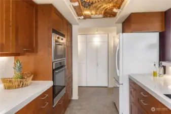 The kitchen features beautiful custom cabinetry with deep drawers, providing ample storage to keep you organized.