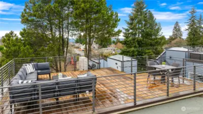 The rooftop deck has a gas barbecue or heater outlet as well as a hose bib and features great views of Mt Rainier as well as filtered views of the Puget Sound and Olympics.