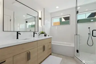 Discover the perfect blend of luxury and functionality in the primary bath, featuring a roomy shower, elegant tub, and double vanity.