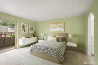 Primary bedroom with separate sink and deck.
