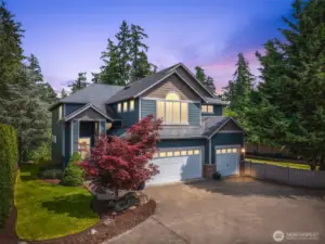 Twilight ambiance showcases the serene setting and welcoming exterior lighting.