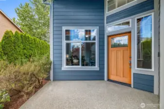 The covered front porch invites you to slow down and savor the peaceful setting.