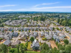 This drone view highlights the generous yard and peaceful surroundings.