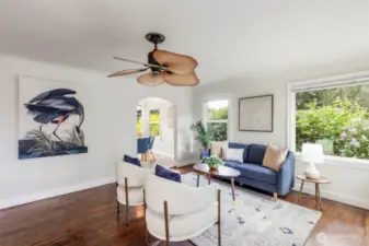 Open living room with bay windows for great natural light.