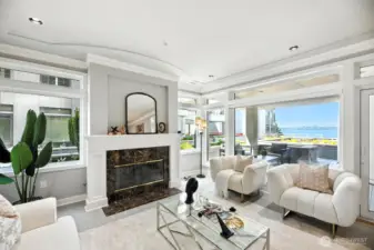A stylish and elegant living room with western views of Lake Washington and beyond.