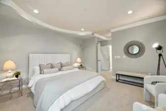 Luxurious main suite with double door entry. This description highlights the high-end features and grand entrance of the main bedroom suite.