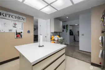 Unit B kitchen, looking back toward laundry room