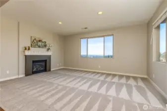 Living room features gas fireplace and a wonderful view of the Auburn valley, all the way to Seattle and Mt Baker on a clear day!