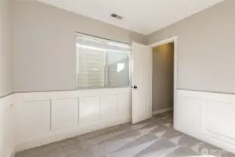 Third bedroom includes wainscoting and walk-in closet