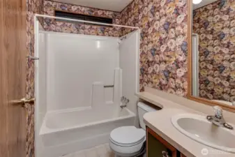 Guest bathroom with shower.