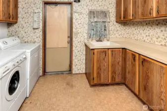 Separate laundry room and utility room.