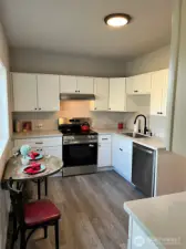 Eat-in Kitchen with quartz and stainless appliances.