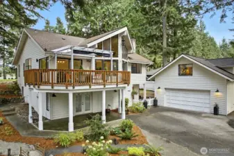 Great upper entertaining deck (plus back deck!) and covered front patio - detached 2-car garage with studio above!