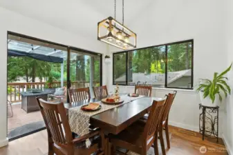 Al fresco dining with slider to covered front deck for BBQs and relaxation entertaining