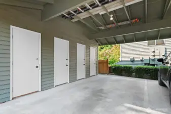 Covered carport off of alley, with large storage closet. Unit's is #4.