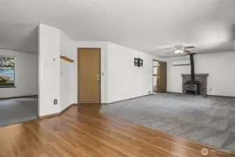 The door in the center is to the garage, and the far left doorway is a half bath for guests