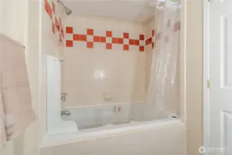 Primary bedroom has a bathroom with a large jetted tub.