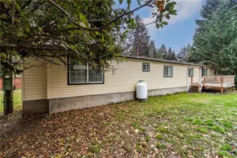 This side of the house shows the 3rd deck which is off of the kitchen and a great place to have your morning coffee.