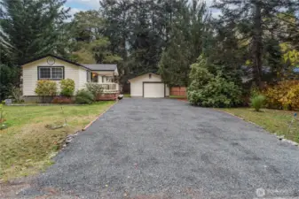 Driveway has ample space for a boat or RV.