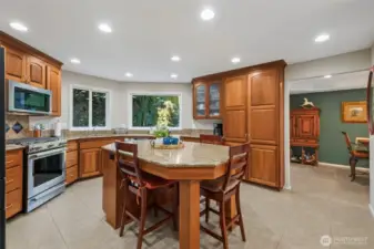 Generous counter space, abundant cabinetry, and casual dining area.