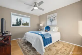 Bright additional bedroom with ceiling fan and large window. (3)