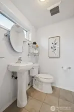 3rd level bathroom with pedestal sink and classic details.