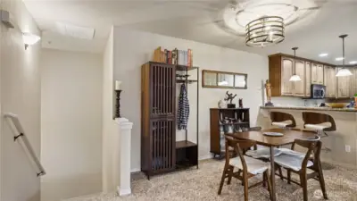 The open floor plan creates an inviting atmosphere, highlighted by a cozy fireplace in the living room—perfect for relaxing evenings at home.