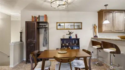 Charming dining space conveniently located in between the living room and kitchen.
