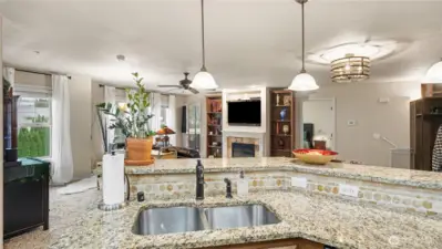 Kitchen sink faces the living area, making it easy to stay connected while hosting or preparing meals.