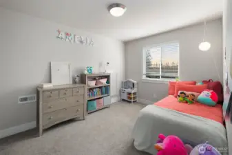 Cozy and cheerful bedroom with soft natural light and a simple, functional layout that’s perfect for everyday living.