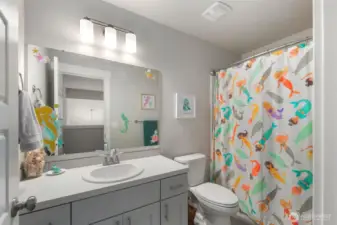 Clean and well-kept full bathroom with a single vanity and tub/shower combo, offering a practical layout for daily routines.