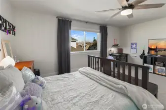 Another view of the bedroom shows flexible space for a desk or reading nook, making it easy to adapt as needs change.