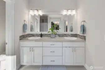 Clean, well-designed bathroom with double sinks and great natural light.