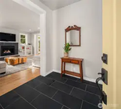 Airy entryway with slate floors.
