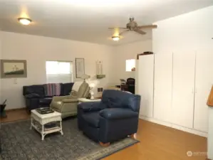 SPACIOUS FAMILY ROOM HAS STORAGE CABINETS  AS WELL AS LAMINATE FLOORING!