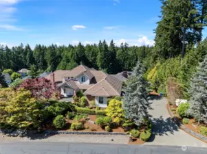 Beautiful gardens surround the home.  A large driveway allows for plenty of overflow parking.