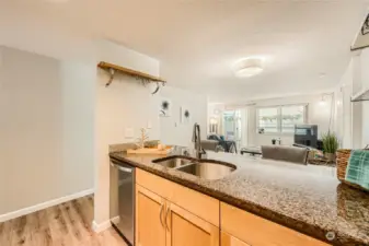 Great counter space, stainless steel appliances, lots of counter space, granite countertops, informal countertop dining and double sink .