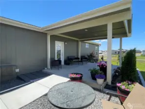 Covered back patio with sun pull down awnings