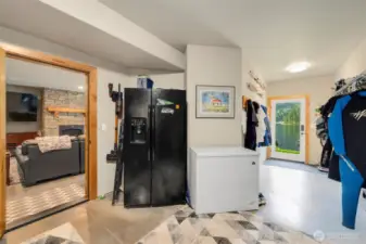 Storage/exercise area located off of "movie room" single door leading to back patio and lake. Lots of area to store all your lake gear