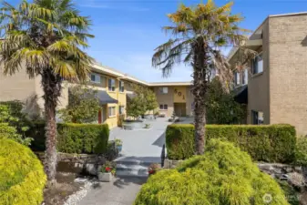 Nicely landscaped surround of building, surrounded by lovely neighborhood of homes