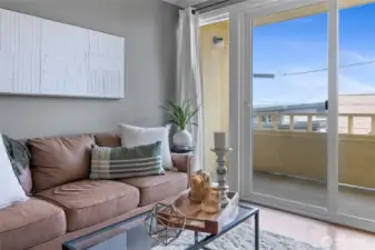 Updated sliding patio door, and private balcony with peekaboo views to Commencement Bay