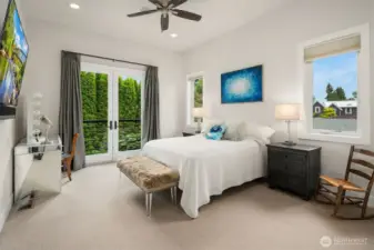 Primary bedroom with a Juliet balcony