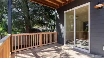 Covered deck at lower level.