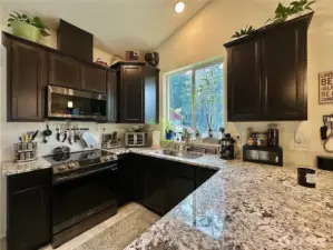Kitchen with granite counters.
